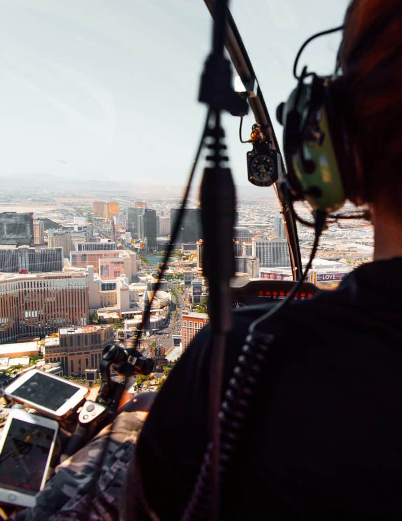 Experience the ultimate Las Vegas thrill with a woman soaring high in a helicopter. Remember to tick off this unique adventure on your Las Vegas Bucket List.