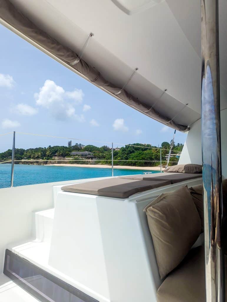The inside of a cameraman boat overlooking the water.