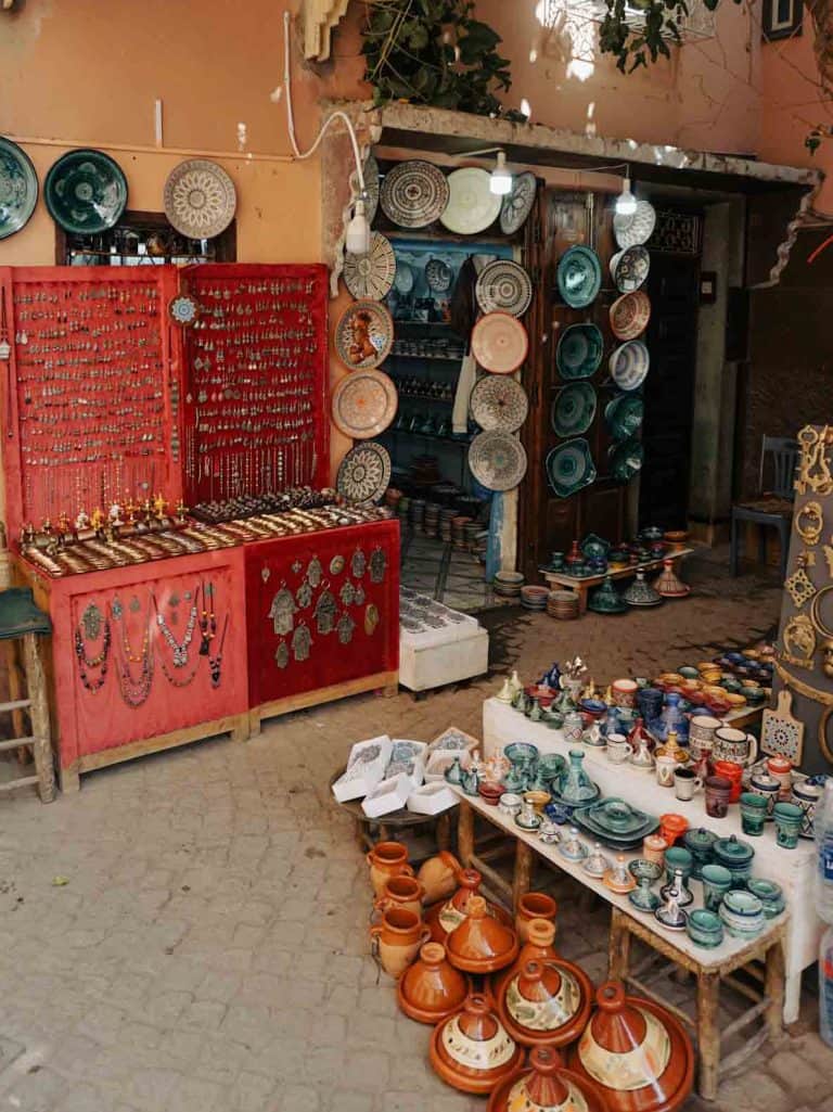 A street market in marrakech with a variety of pots and bowls.